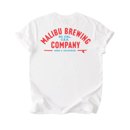The Red, White & 'Bu Tee is a white unisex puff print t-shirt with red and blue "Malibu Brewing Company So. Cal. U.S.A." text and a red surfboard graphic on the back—made in California, perfect for summer.
